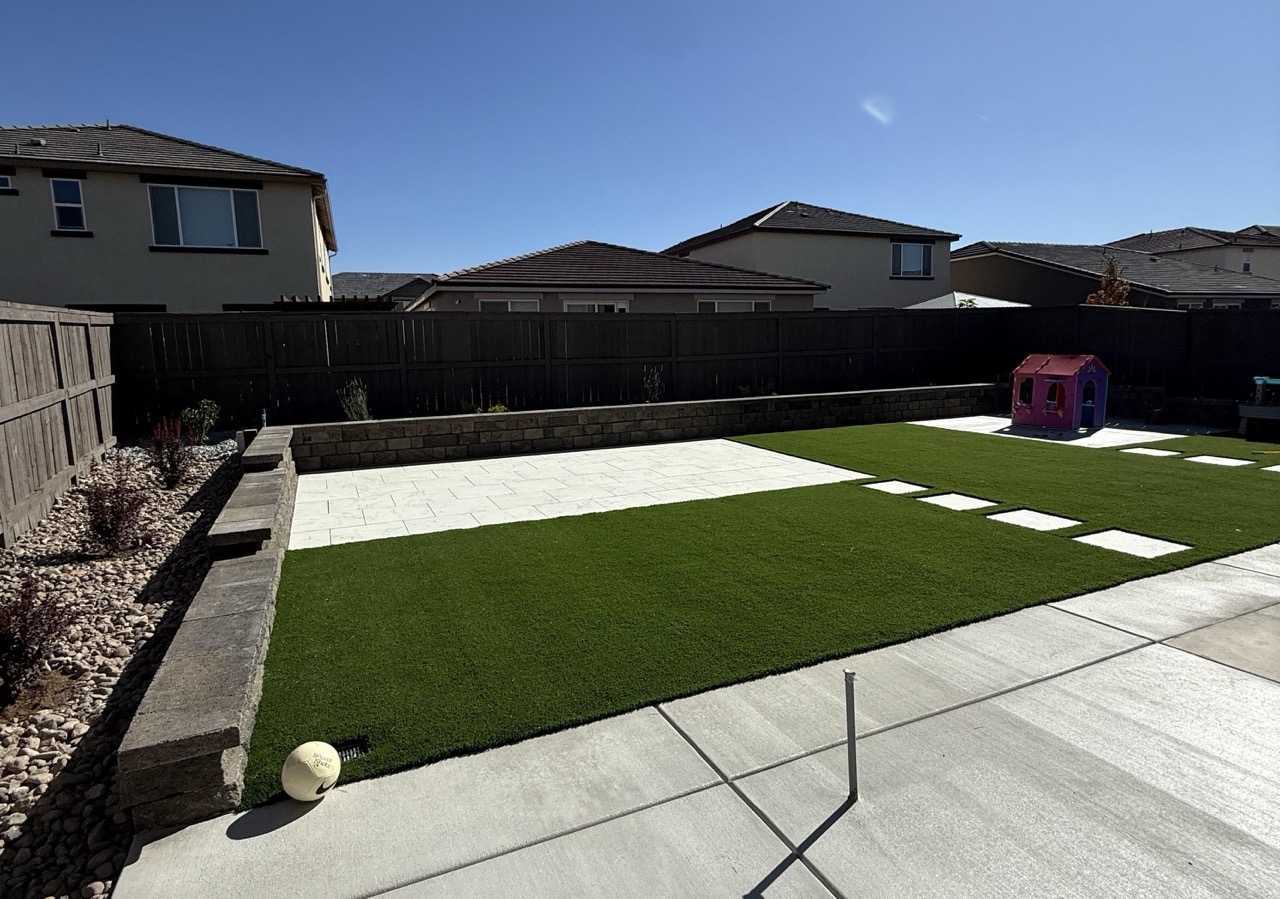 Artificial turf play area with stepping stones in a Sparks backyard